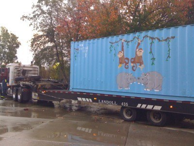 Shipping container being transported